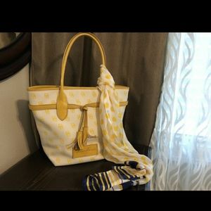 Beautiful Dooney and Burke New York yellow & cream